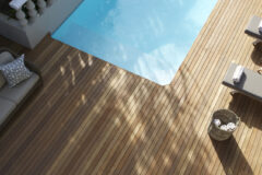 a pool area at The Trevoyan Guest House with wooden decking