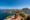 Young couple tourist enjoying the beautiful landscape at Padar island in Komodo National Park, Indonesia