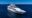a view of a white yacht called Grand Majestic, floating on the sea in Galapagos