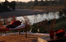 Day beds overlooking the Banjar River at Flame of the Forest